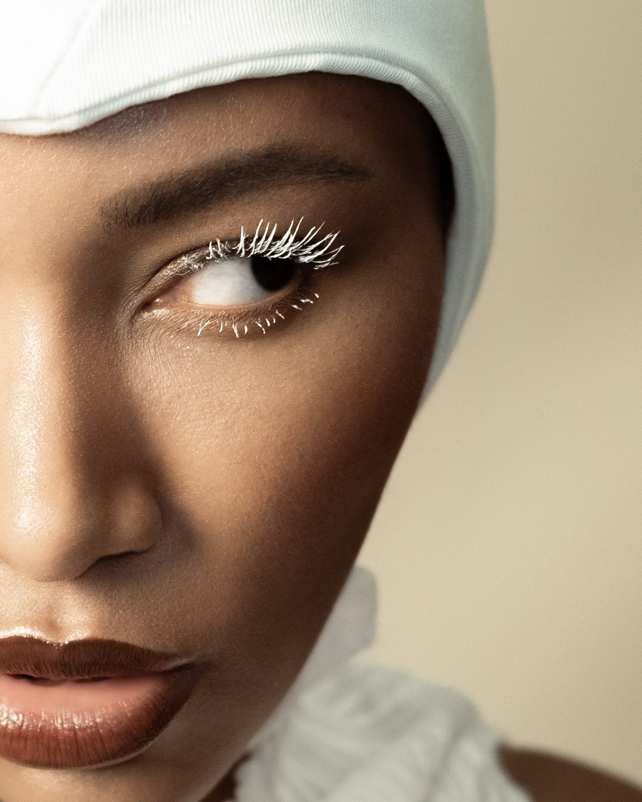 Close-up of an eye with white lashes